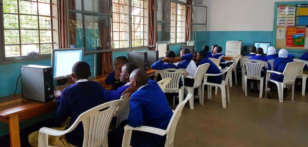 African schoolchildren using computer lab