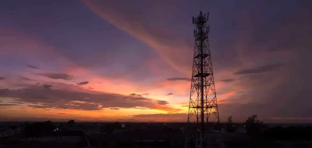 Cell tower with sunset sky in back