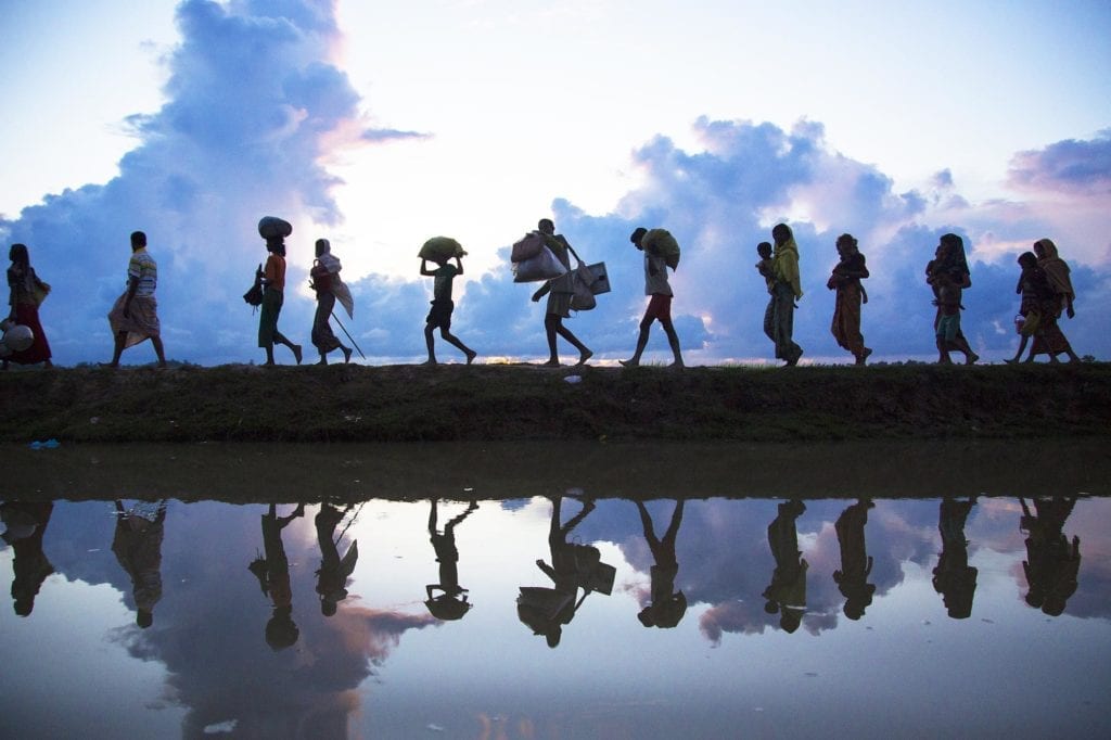Refugees walking across landscape