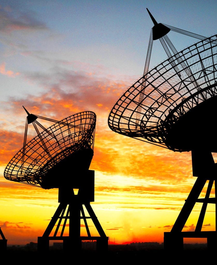Ground Earth Stations silhouette with sunset sky in backdrop